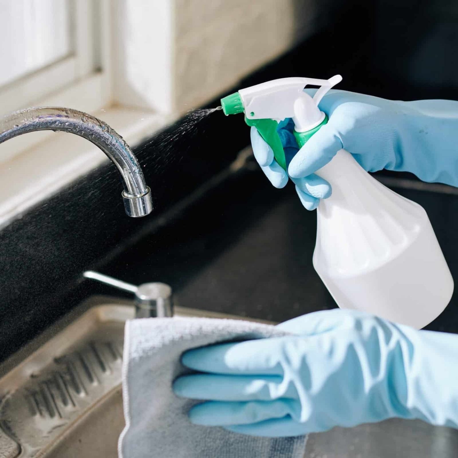 Professional kitchen sink cleaning service by Classic Comfort Cleaners Co.